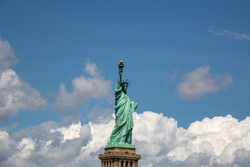 Fototapeta premium New York City / USA - AUG 22 2018: The statue of liberty in clear blue sky view from river