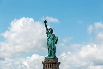 Obraz premium New York City / USA - AUG 22 2018: The statue of liberty in clear blue sky view from river