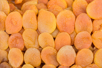 Cut dried apricots arranged for sale.Top of view.