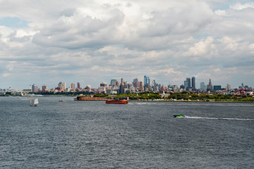 New York City / USA - AUG 22 2018:  Governors Island and skyscraper of Brooklyn downtown view from...