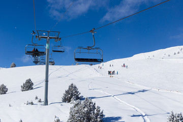 Fototapeta na wymiar Line of chairlift in the mountains