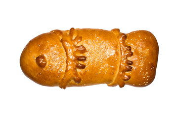 Loaf in the form of fish.Fish-shaped cake on white background.Ruddy fish pie isolated on white...