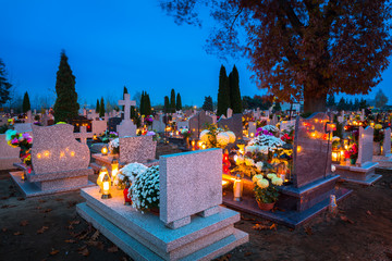 Colorful candles on the cemetery at All Saints Day, Poland