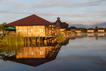 Obraz premium Wooden resort eco houses by the lake in Myanmar.