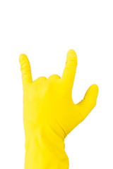 Obraz premium Hand in yellow rubber glove on white background showing gesture sign of the horns, metal horns, devil horns, rock horn. Isolated glove for cleaning on white background. The outside of the palm.