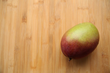 fresh mango on bamboo table isolated. Top view. Flat lay. With copy space for text or image.