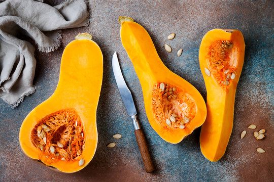 Butternut squash on rustic background. Healthy fall cooking concept
