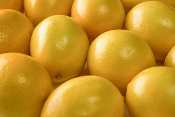 Ripe yellow lemons on white background, texture, close-up.