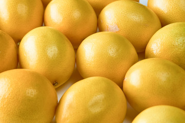 Ripe yellow lemons on white background, texture, close-up.