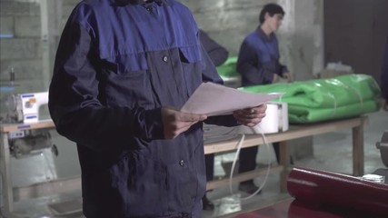 male warehouse workers in the production