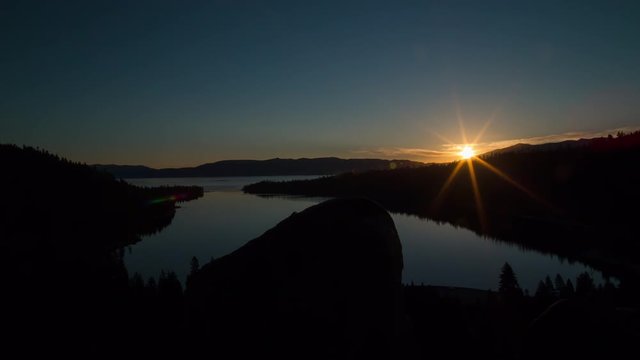 Sunrise over mountains and lake