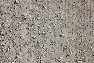 Dirt road tire tracks close up pebbles