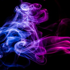 Colored smoke on black background