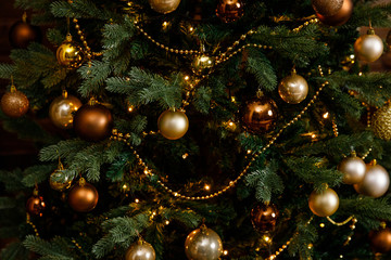 Obraz na płótnie Canvas Christmas or New Year background: lamps, green cristmas tee, sofa, wooden wall, Santa Claus