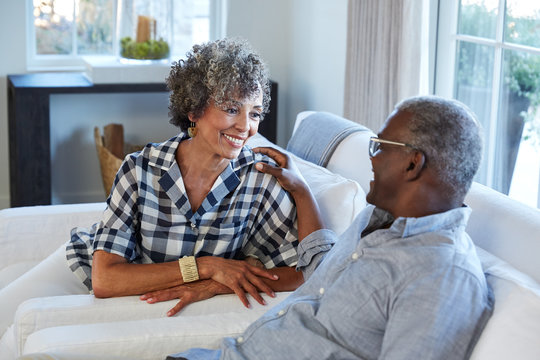 African American Senior Couple laughing and having a good time together at home