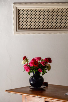 Vase of roses on a table