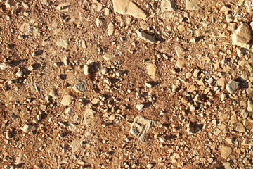 Dirt road stones markings close up