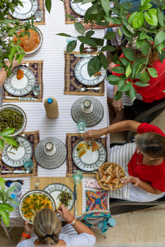 People serving themselves a plate of food