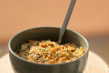 Bowl of bulgur wheat, roasted pumpkin, feta cheese and parsley salad. Selective focus.
