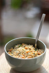 Bowl of bulgur wheat, roasted pumpkin, feta cheese and parsley salad. Selective focus.
