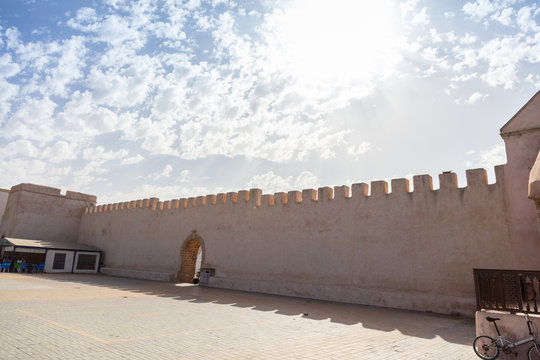 Fortified shaped wall with an arched entryway