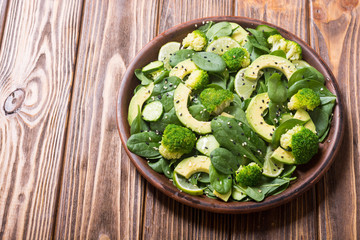 Green baby spinach salad with avocado