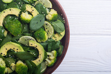 Green baby spinach salad with avocado