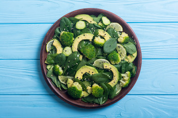 Green baby spinach salad with avocado