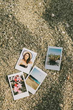 Summer Themed Polariods On The Beach Sand
