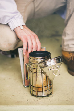 Hive: Beekeeper Starting Up Smoker With Fuel