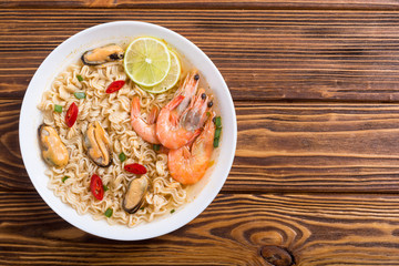 Instant noodles soup with shrimps and mssels . Asian food