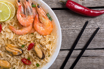 Instant noodles soup with shrimps and mssels . Asian food