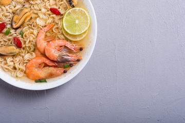 Instant noodles soup with shrimps and mssels . Asian food