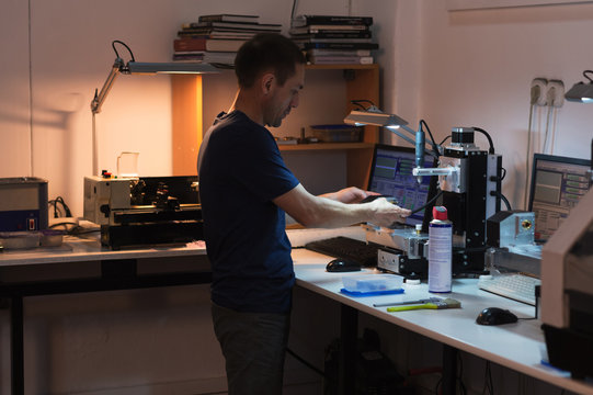 Man setting machinery for work