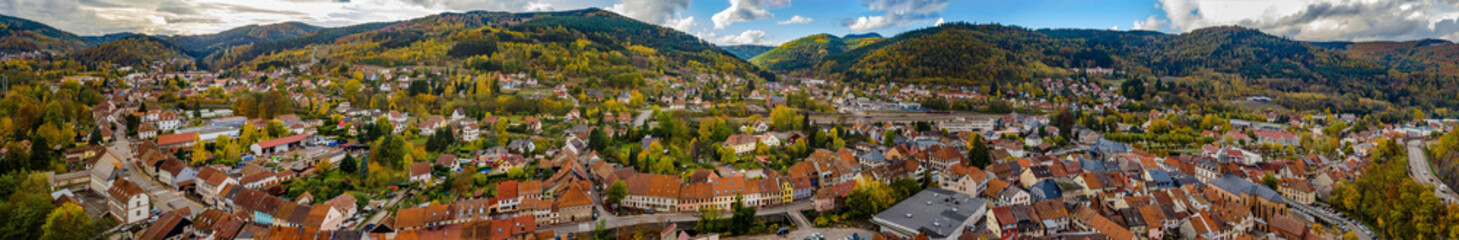 Fototapeta na wymiar Autumnal panorammic aerial view of city Schirmeck in Alsace
