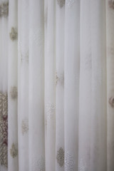 Beautiful thin curtains texture, transparent tulle, examples in the store