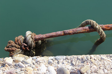 Old rusty dock cleat detail diagonal