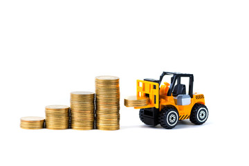 Mini forklift truck loading stack coin with steps of gold coin, isolated on white background with copy space, business finance and banking industrial concept.