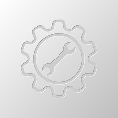 wrench in gear. Paper design. Cutted symbol. Pitted style