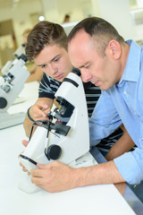 scientist inspecting a material