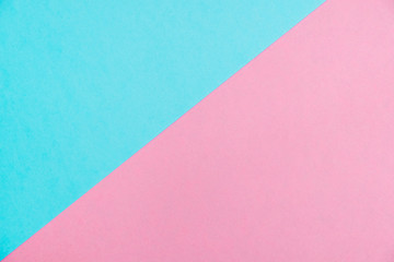 Pastel colored paper flat lay top view, background texture, pink and blue.