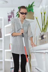 blind woman maneuvering the house interior