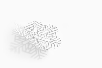 Carved paper snowflake folded in half, bent, casts a beautiful shadow 3d illustration