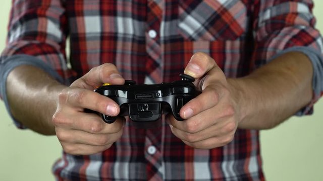 Hands of dedicated gamer using a game controller