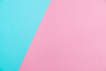 Pastel colored paper flat lay top view, background texture, pink and blue.