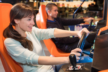 young people at wheel of arcade games