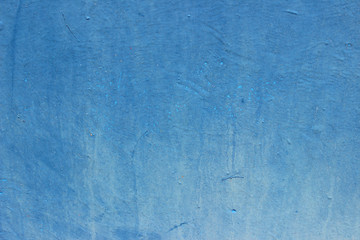 Uneven faded blue wooden surface plank fragment traces markings