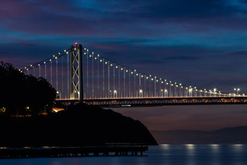 Fototapeta premium Bay Bridge at Dawn Connecting Treasure Island with San Francisco