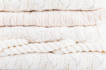 White knits pile. Warm cozy home concept