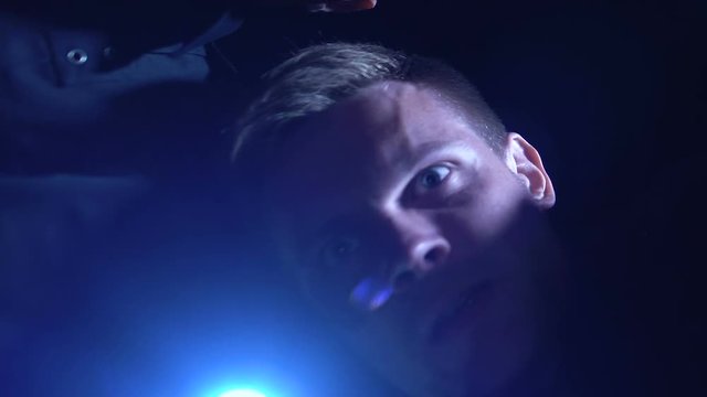 Cops with flashlight looking for evidence at crime site to get on murderer trail